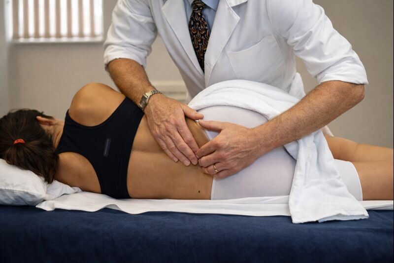 Osteopath treating a patient